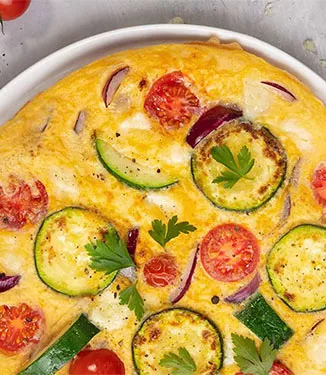 Omelette with tomato courgette and pecorino