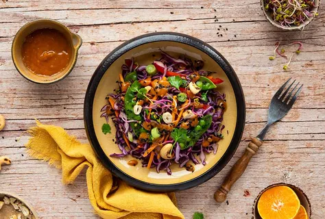 Red cabbage salad with cashews & snow peas