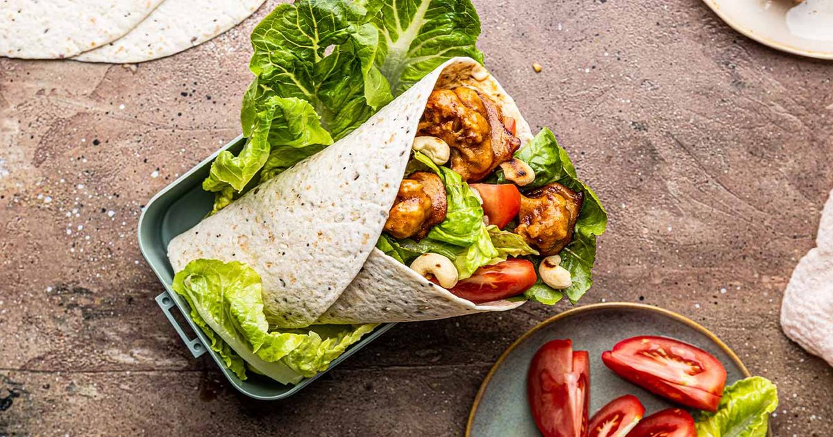 Tortilla wraps with teriyaki cauliflower, romaine lettuce and tomatoes | Kikkoman