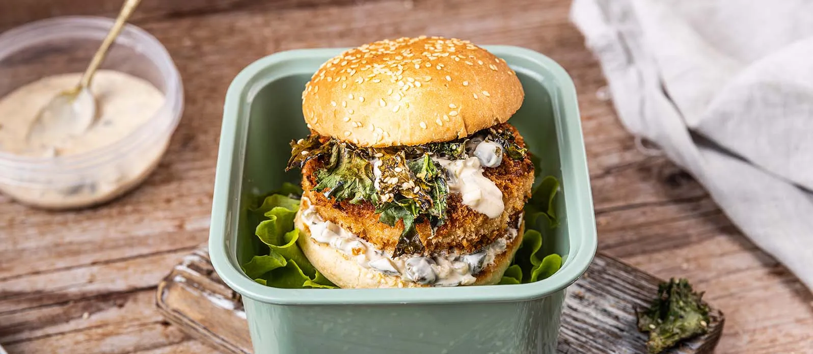 Fish burger with kale and yoghurt sauce