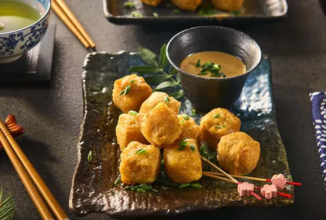 Crispy fish takoyaki with teriyaki peanut dip