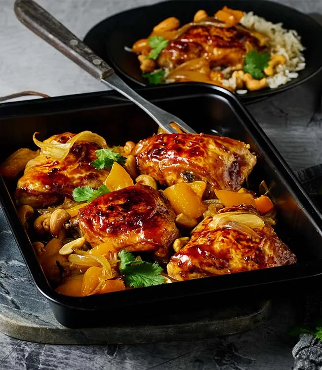 Garlicky Glazed Chicken Thighs baked with Cashews and Peppers
