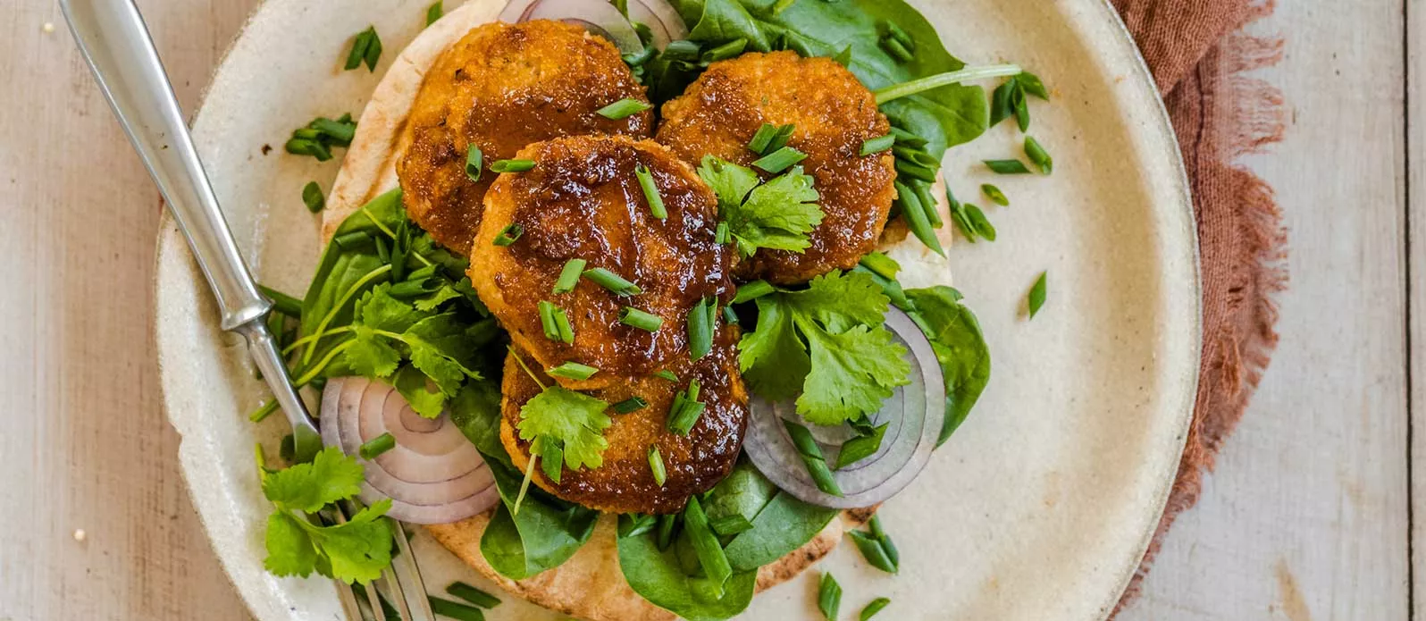 Pitta topped with spiced lentil patties and spinach