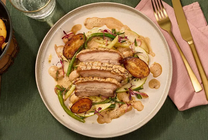 Crispy pork belly with bean salad & fondant potatoes