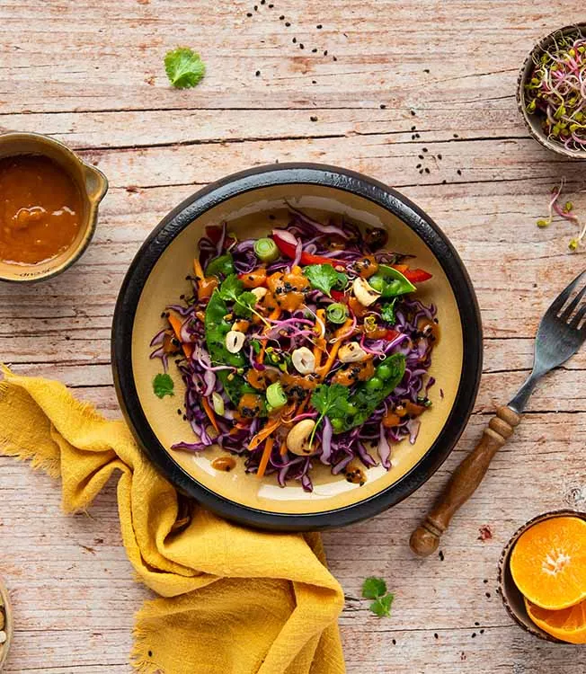 Red cabbage salad with cashews & snow peas