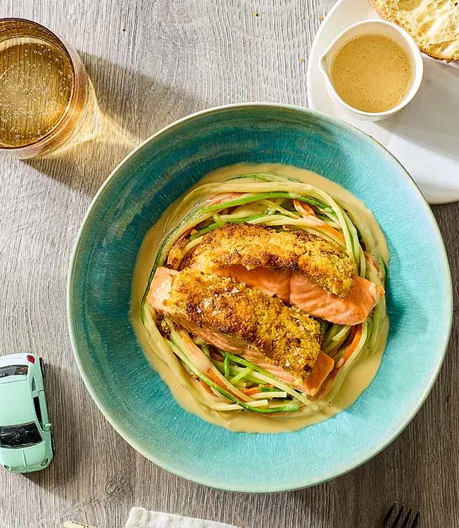 Crispy salmon on vegetable noodle nest
