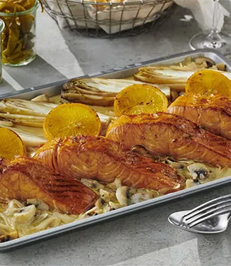 Salmon fillet in orange sauce with mushroom cream sauce