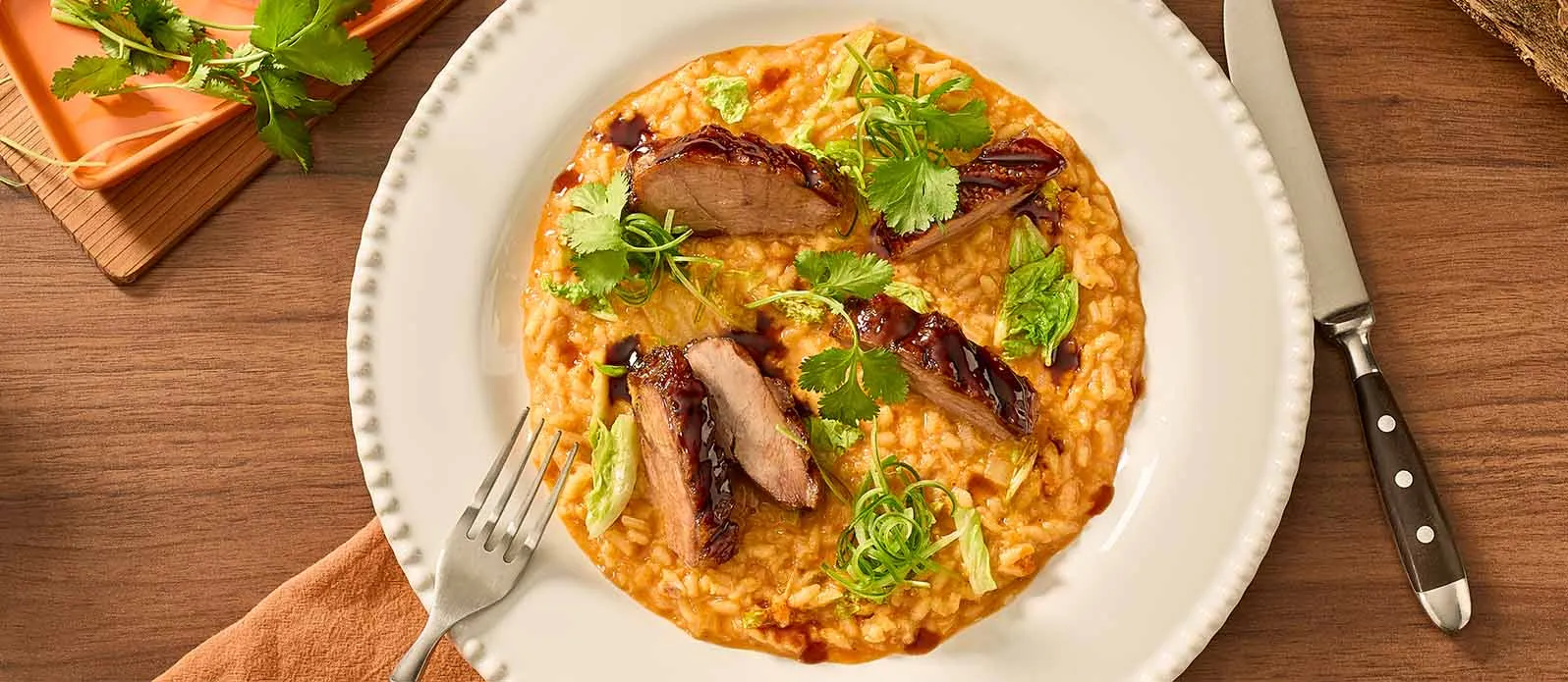 Kimchi risotto with crispy goose breast