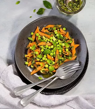 Red lentil penne with avocado, peas and parsley pesto