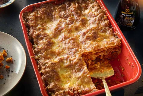 Umami lentil lasagne with a cheesy sesame crust