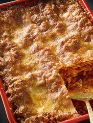 Umami lentil lasagne with a cheesy sesame crust