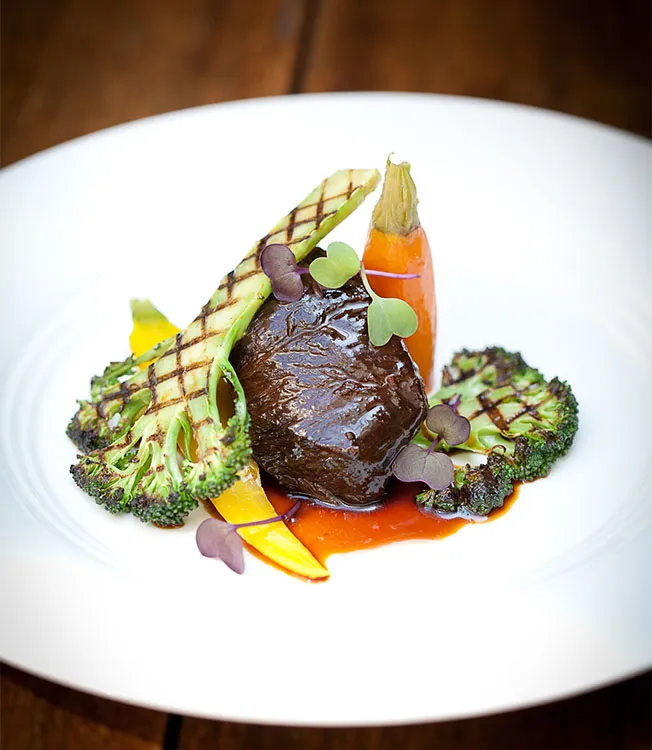 Soy braised beef cheek with grilled broccoli and heritage carrots
