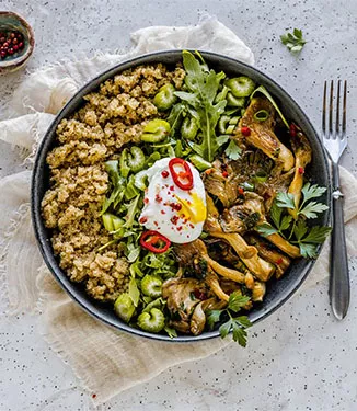 Amaranth bowl with oyster mushrooms and poached egg