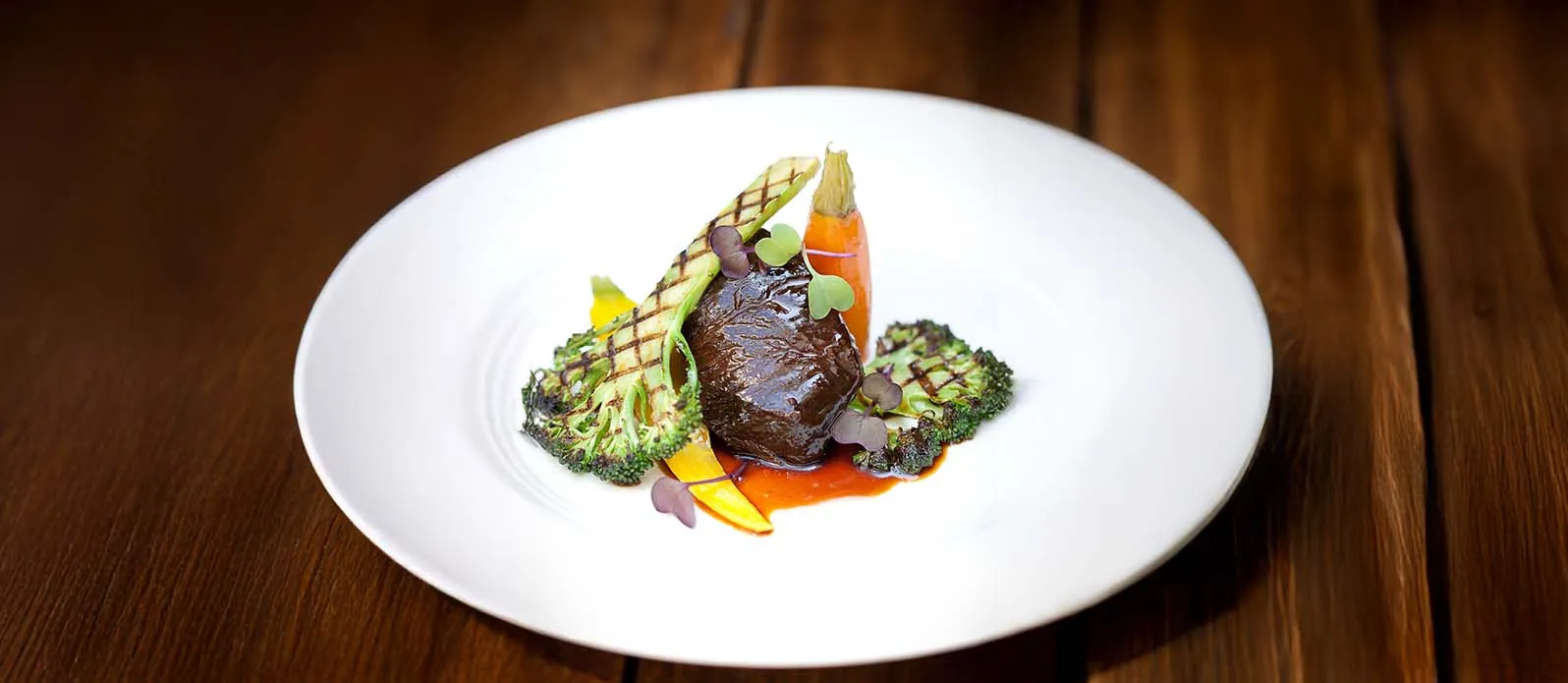 Soy braised beef cheek with grilled broccoli and heritage carrots