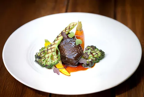 Soy braised beef cheek with grilled broccoli and heritage carrots