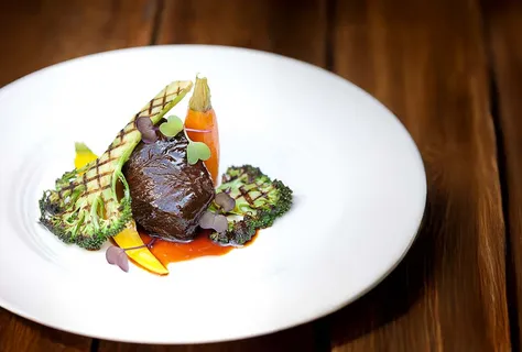 Soy braised beef cheek with grilled broccoli and heritage carrots