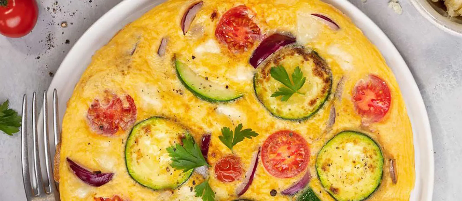 Omelette with tomato courgette and pecorino