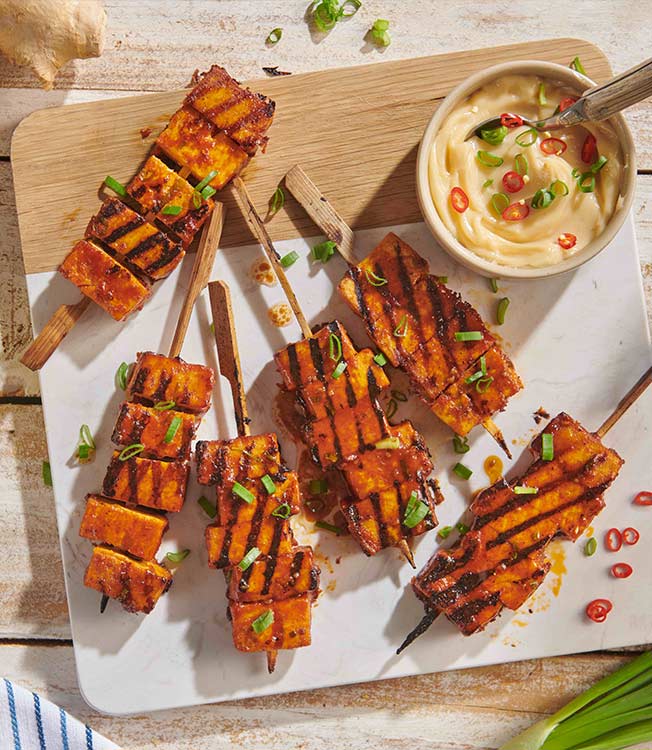 Teriyaki-marinated tofu skewers with sesame oil and peanut butter